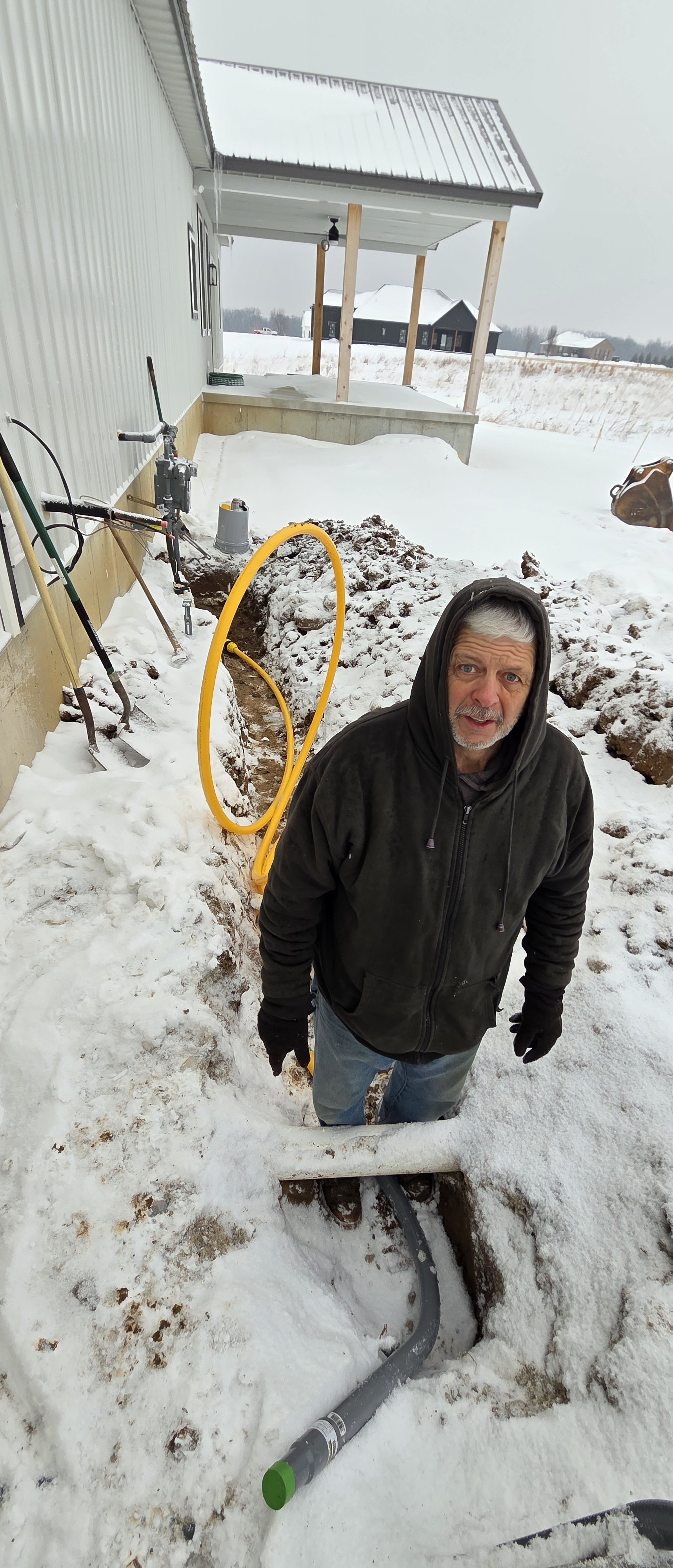 Duane braving the elements, so you stay nice and warm when the power goes out !